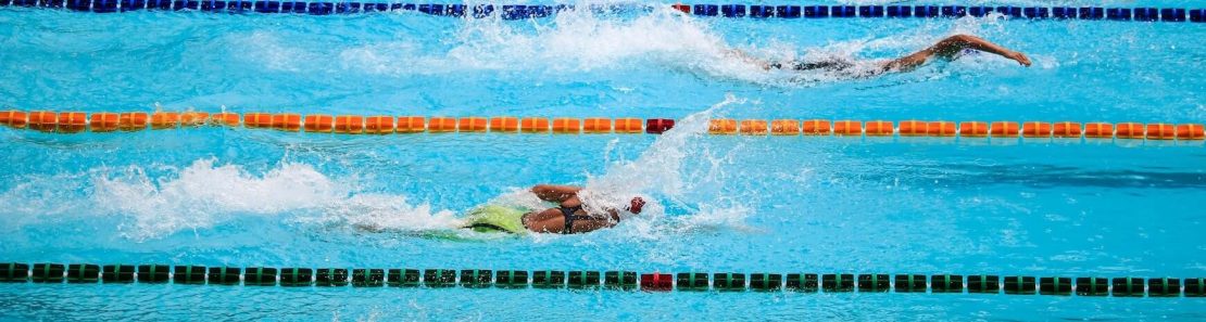 2018 High School Rankings banner image swimmers racing in a pool