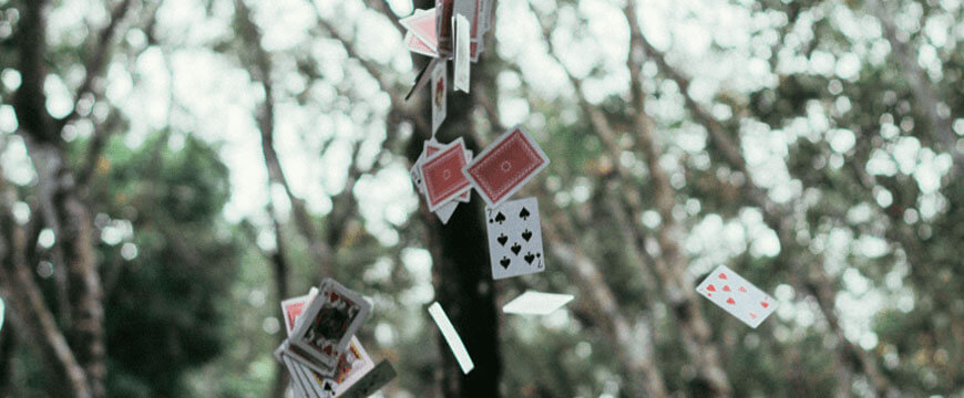 blog-success-secrets-nathans-hacks-how-to-defeat-distraction-to-focus-100%-on your HSC-Tricks-cards-in-air-against-green-trees