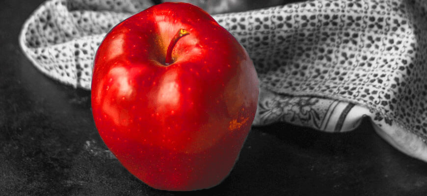 blog-literary-techniques-contrast-red-apple-on-black-background