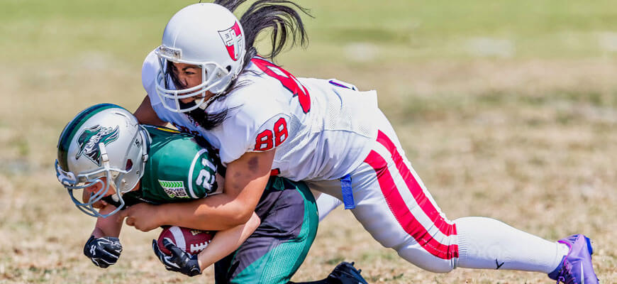 a female grid-iron player absolutely cleaning up a male running back *BOOOM* blog-english-5-comprehension-skills-year-6-students-need-for-high-school-tackled