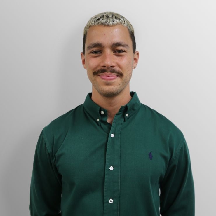 Mr Marcus Khoudair English teacher at Matrix Education wears a dark green button up collared shirt