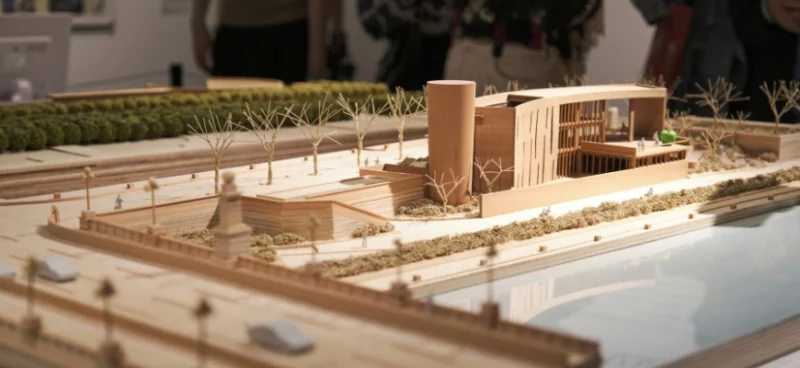 architectural model of a modern building with surrounding landscape