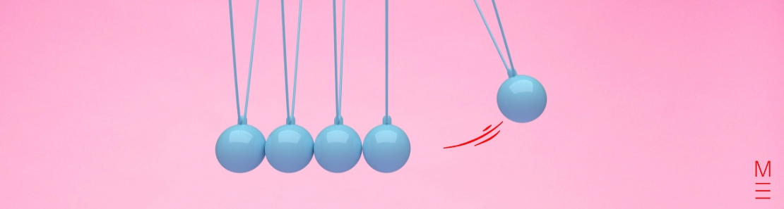 matrix education Newton's cradle with blue spheres against a pink background, symbolising motion from the Physics VCE exam