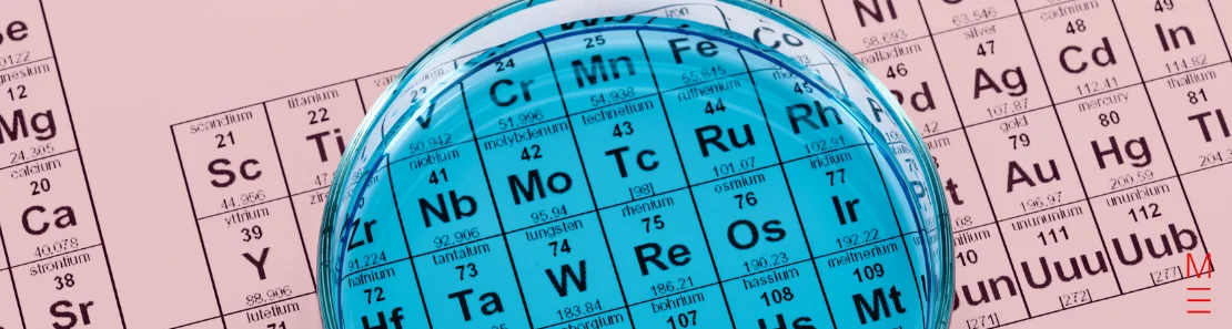 matrix education Close-up of the periodic table viewed through a blue-tinted Petri dish