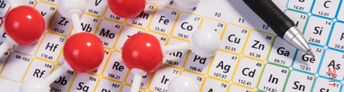 matrix education A molecular model placed over a periodic table, symbolising the 2024 VCE Chemistry Exam