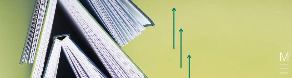 Open books with teal arrows on a green background, symbolising progress.