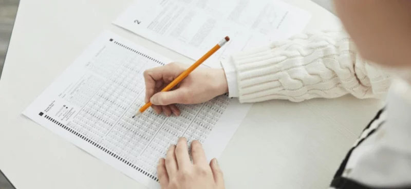matrix education Student filling out a multiple-choice answer sheet in an exam