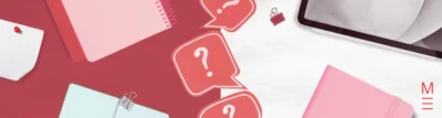 red and white background with stationery spread across and question marks running along the middle
