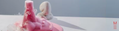 matrix education A chemical reaction in a beaker with pink foam overflowing with artistic vapor effects