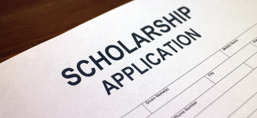 close up of a piece of paper titled 'scholarship application'