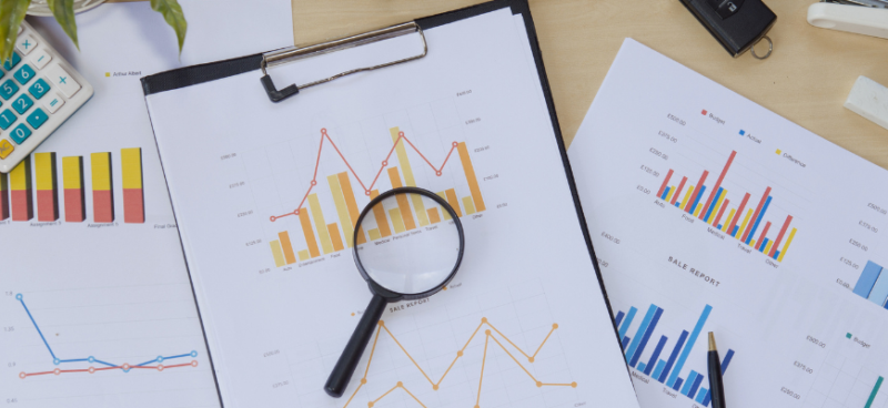matrix education scientific papers with graphs and a magnifying glass. 
