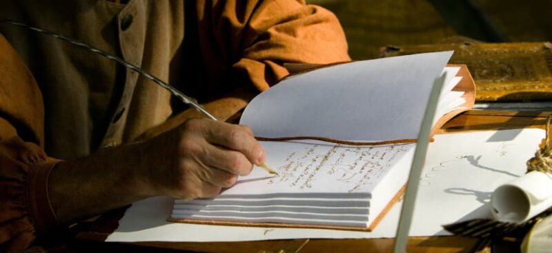matrix education student writing on paper with feather pen for VCE English Units 1 and 2