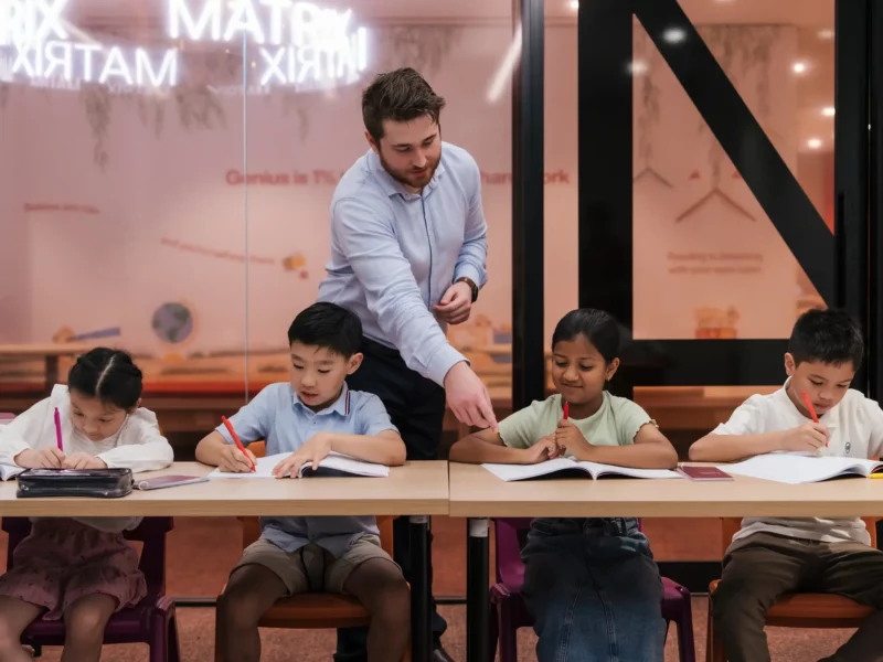 teacher teaching primary students